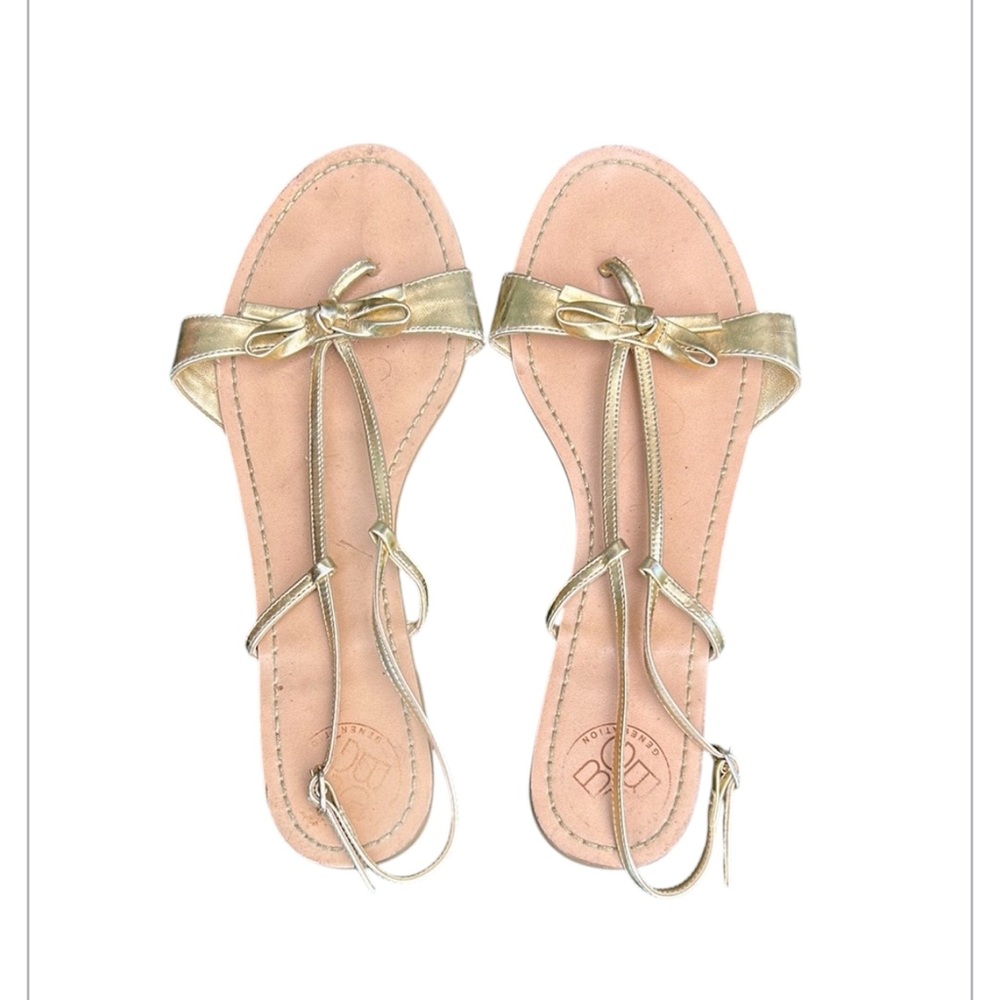 BCBGeneration Women's Bow Gold Metallic Strappy Flat Sandal